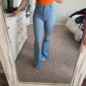 Light wash flare jeans with star detailing